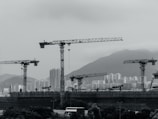 Construction cranes populate the cityscape.