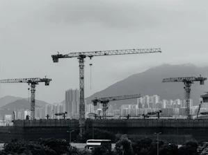 Construction cranes populate the cityscape.