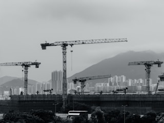 Construction cranes populate the cityscape.