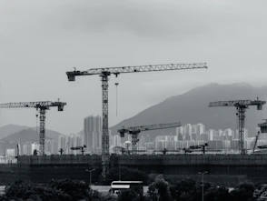 Construction cranes populate the cityscape
