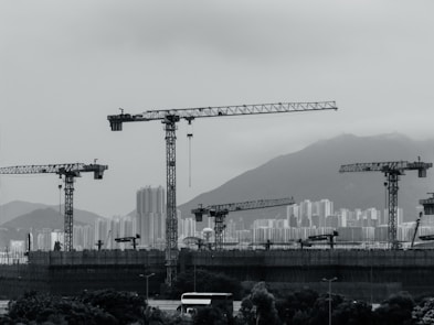Construction cranes populate the cityscape.