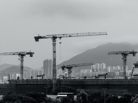 Construction cranes populate the cityscape.