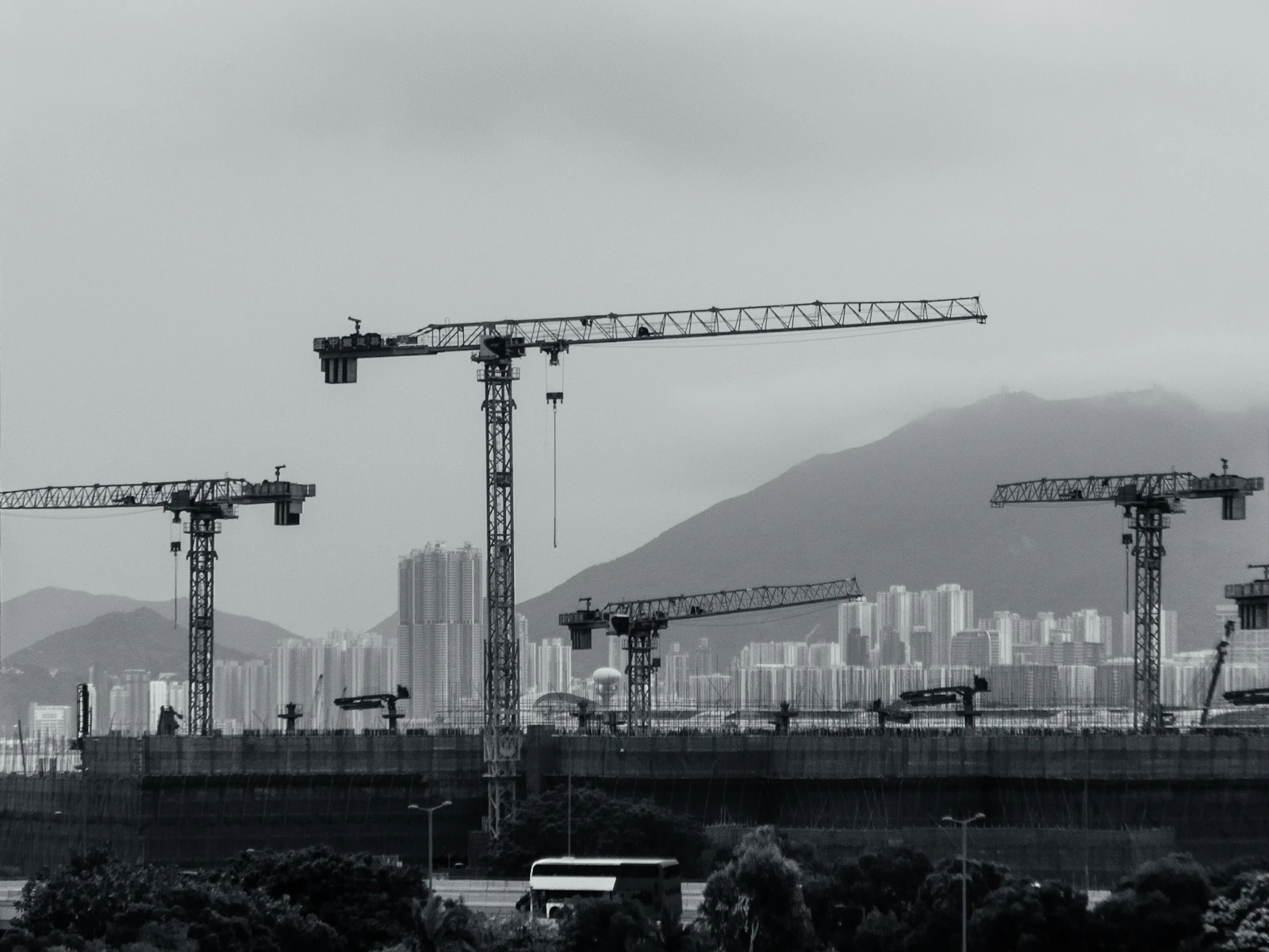 construction cranes across a city skyline