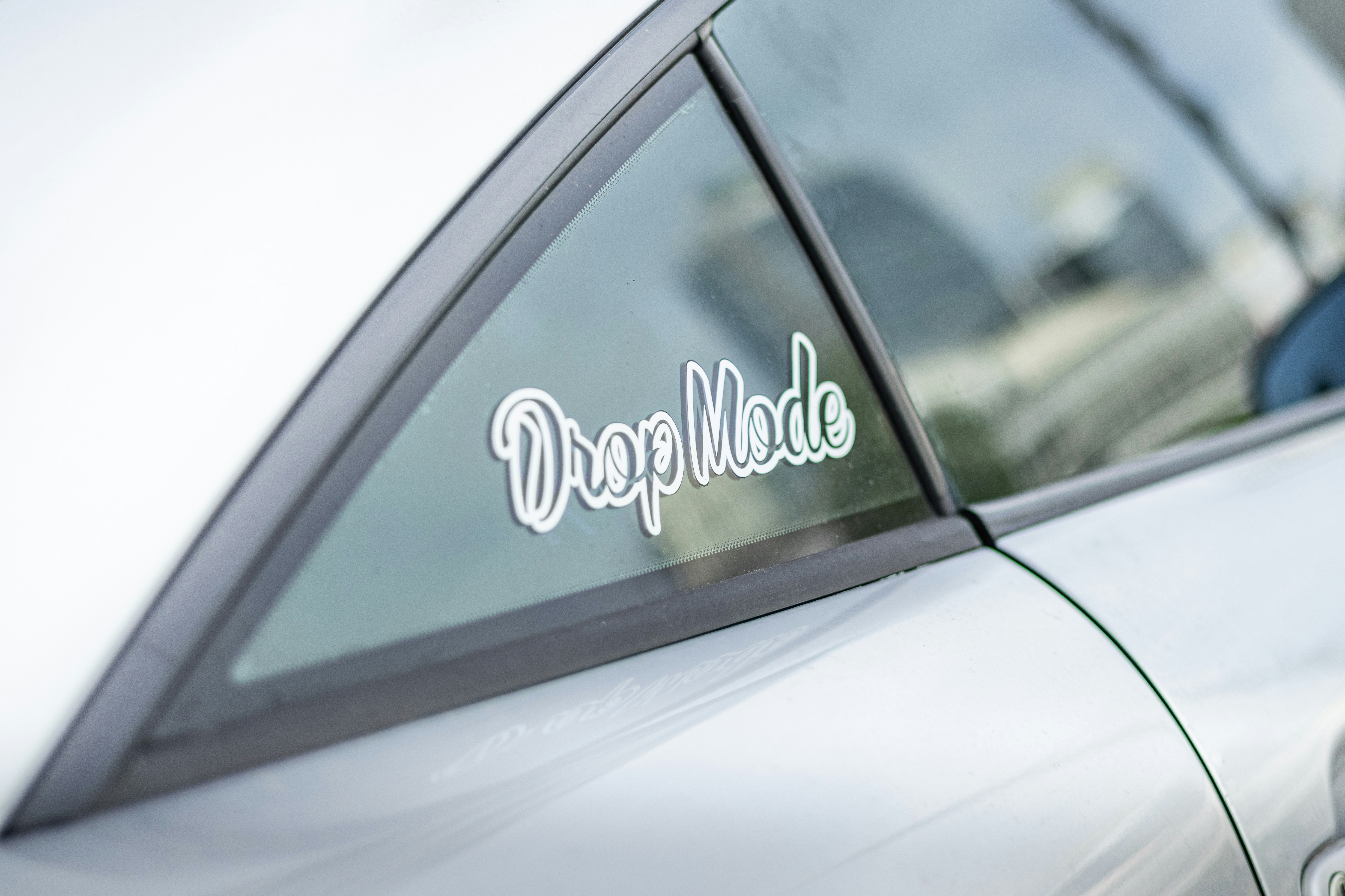 Modified car with drop mode sticker
