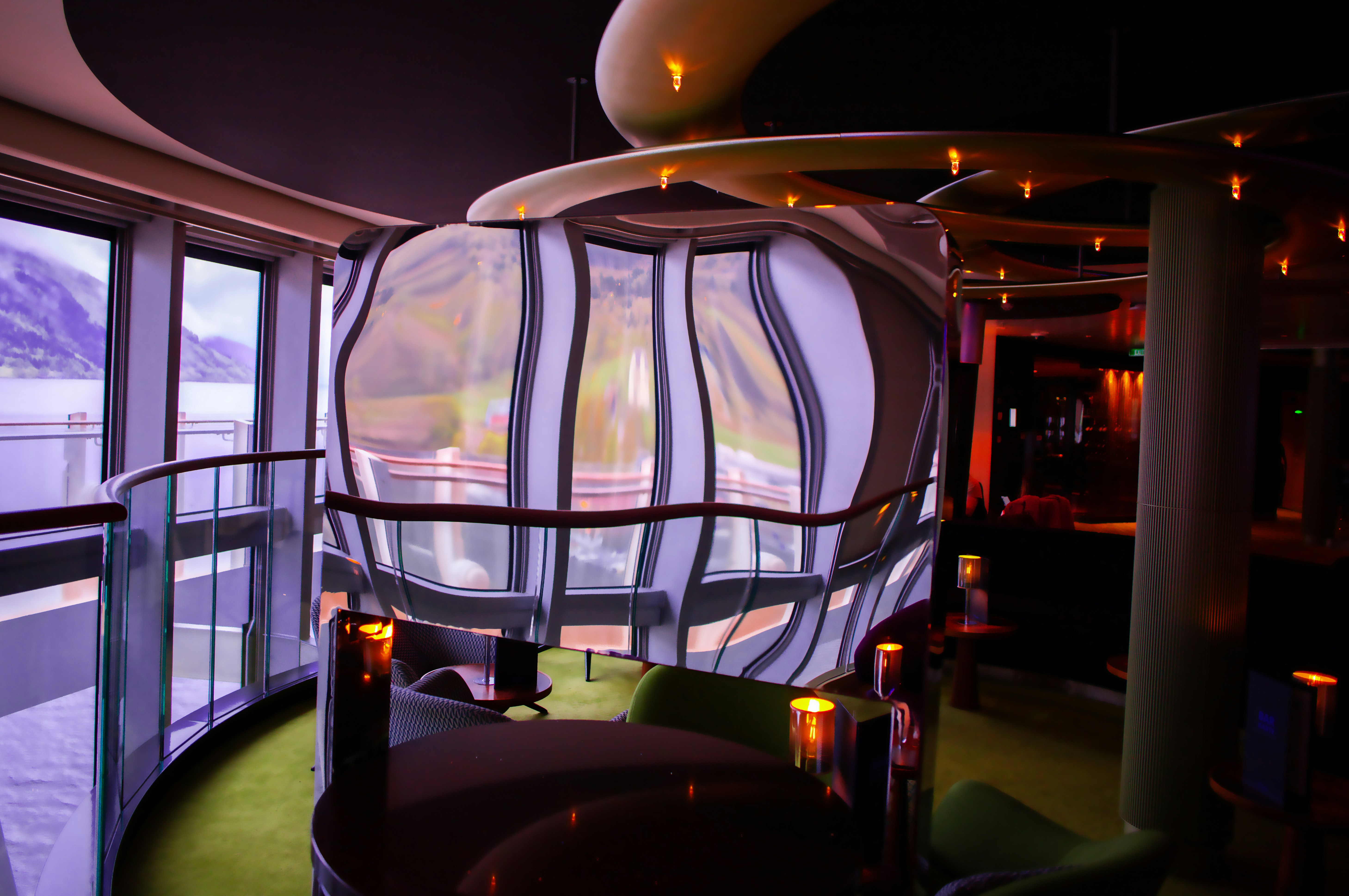 A modern bar with unique lighting fixtures