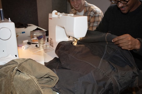 People are sewing clothes with sewing machines.