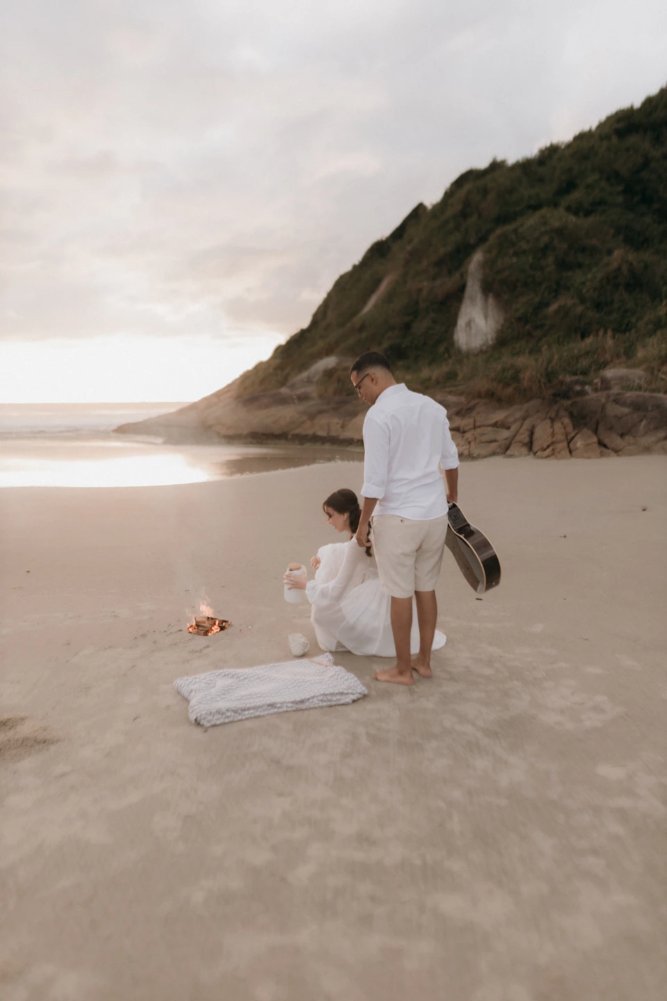 Couple enjoying a picnic on a beach
