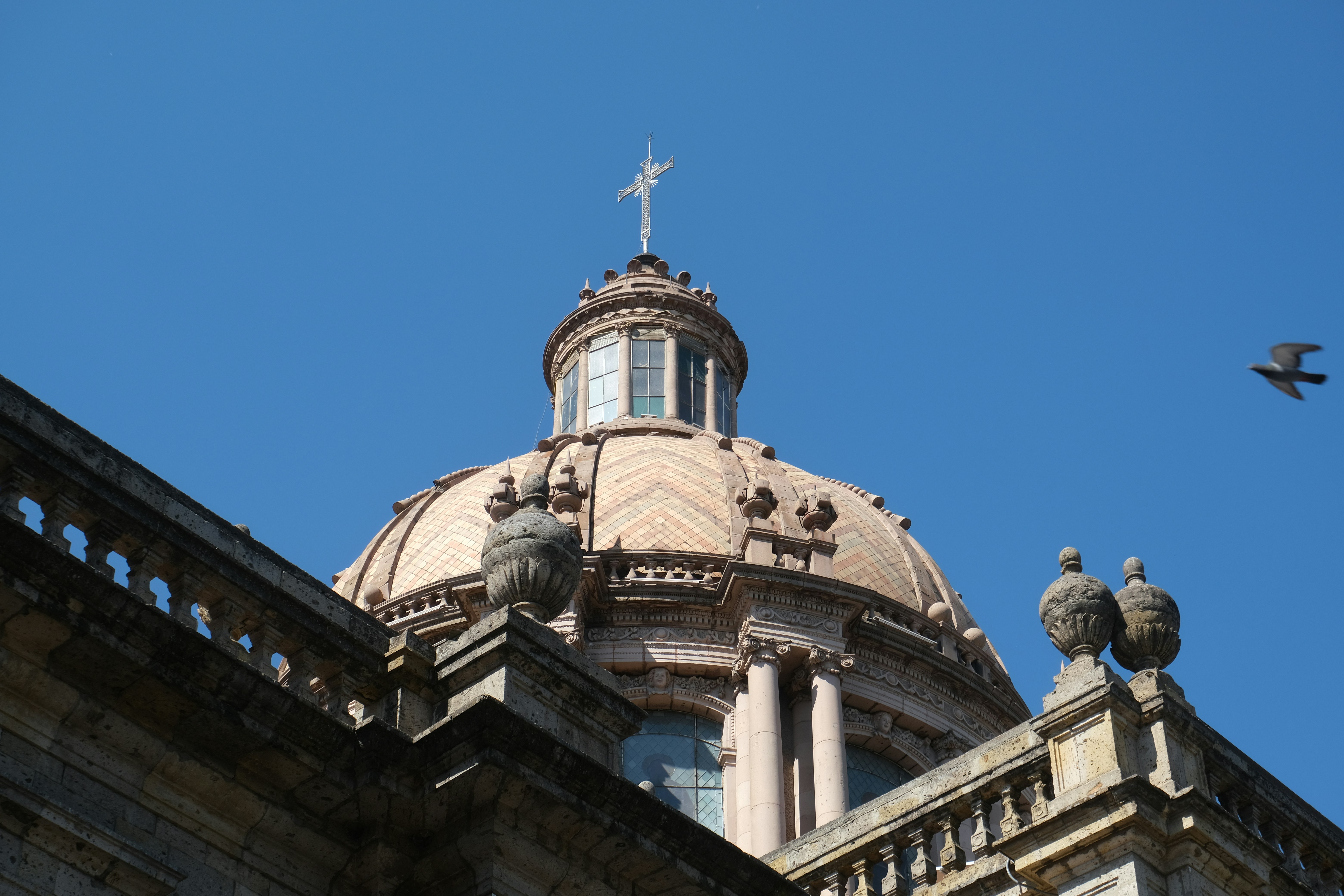 Guadalajara Cathedral with twin yellow spires at sunset