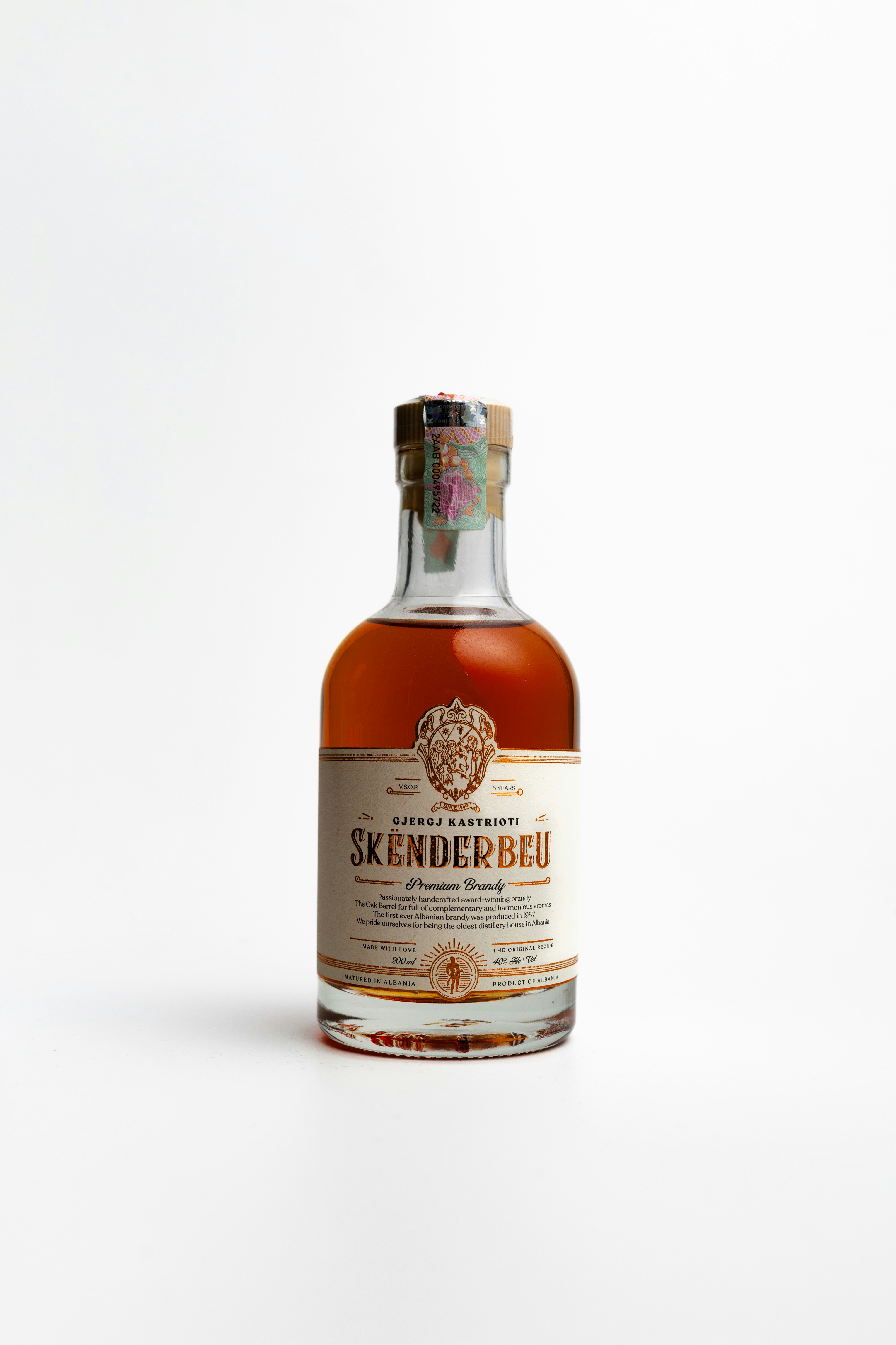 A bottle of skenderbeu liquor stands alone.