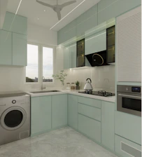 Modern kitchen with light blue cabinets and appliances.