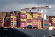 A cargo ship is heavily loaded with containers.