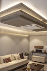 A modern living room features decorative ceiling lights.