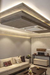 A modern living room features decorative ceiling lights.