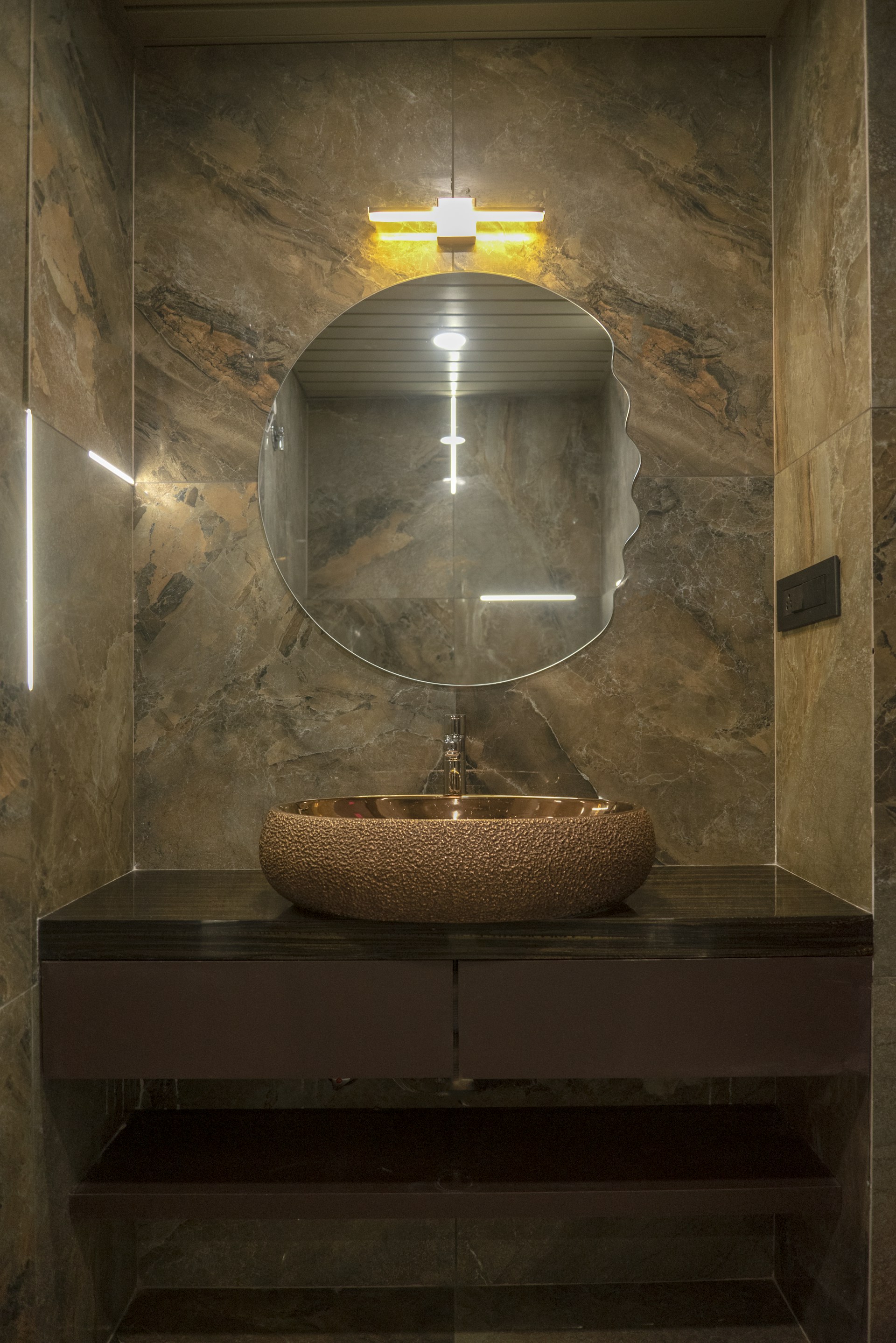 A modern and stylish bathroom vanity is shown.