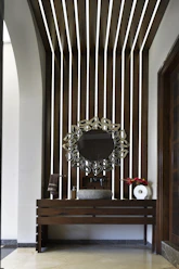 A modern bathroom with a decorative mirror