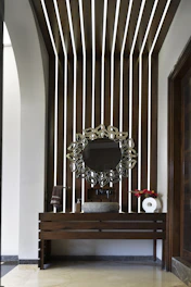 A modern bathroom with a decorative mirror
