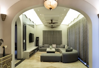 A modern living room with a curved couch.