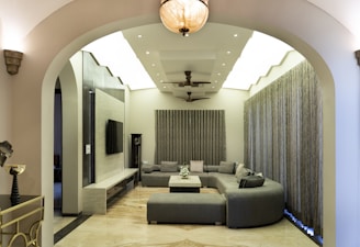 A modern living room with a curved couch.