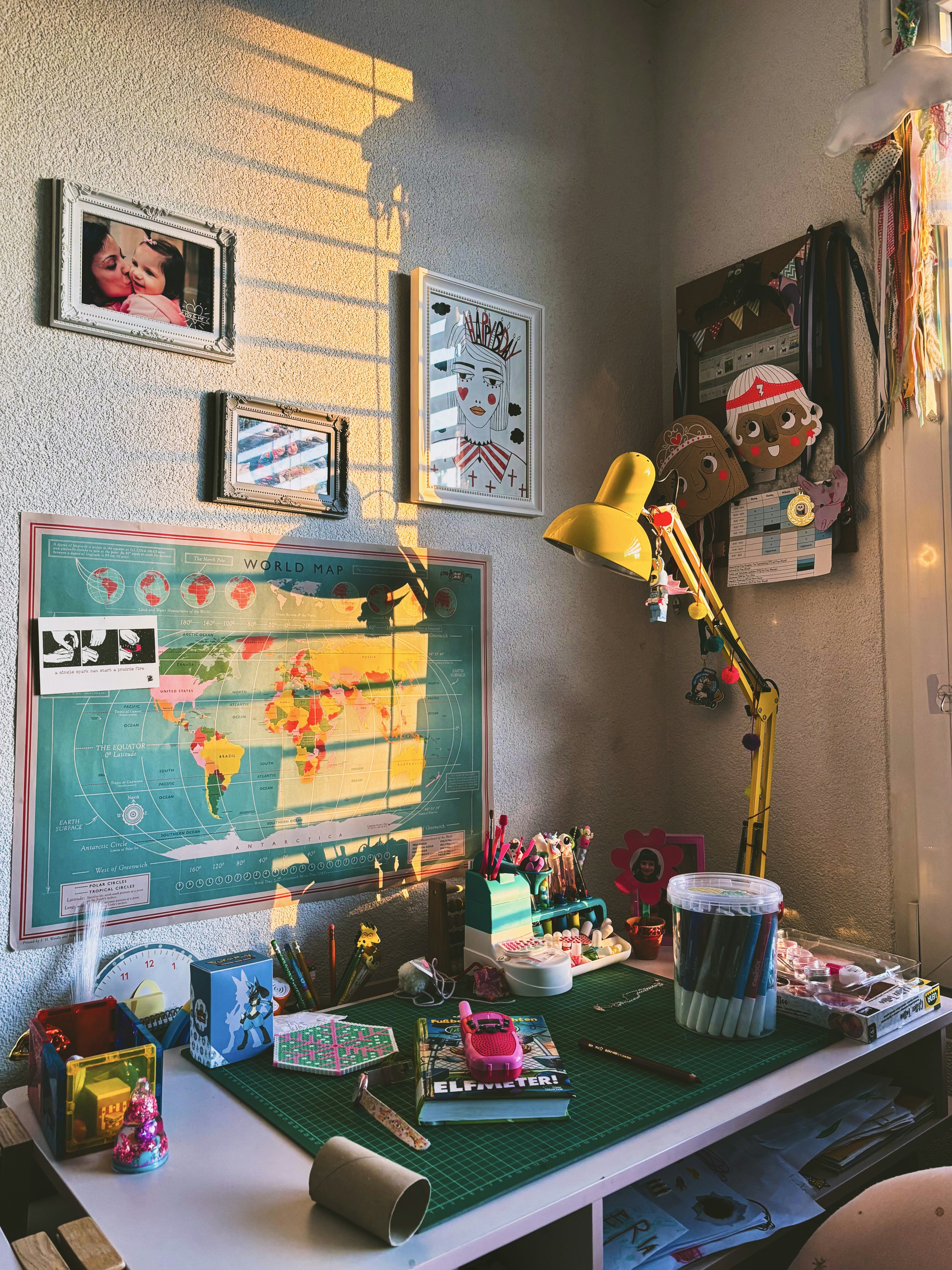 A colorful, creative workspace bathed in sunlight.