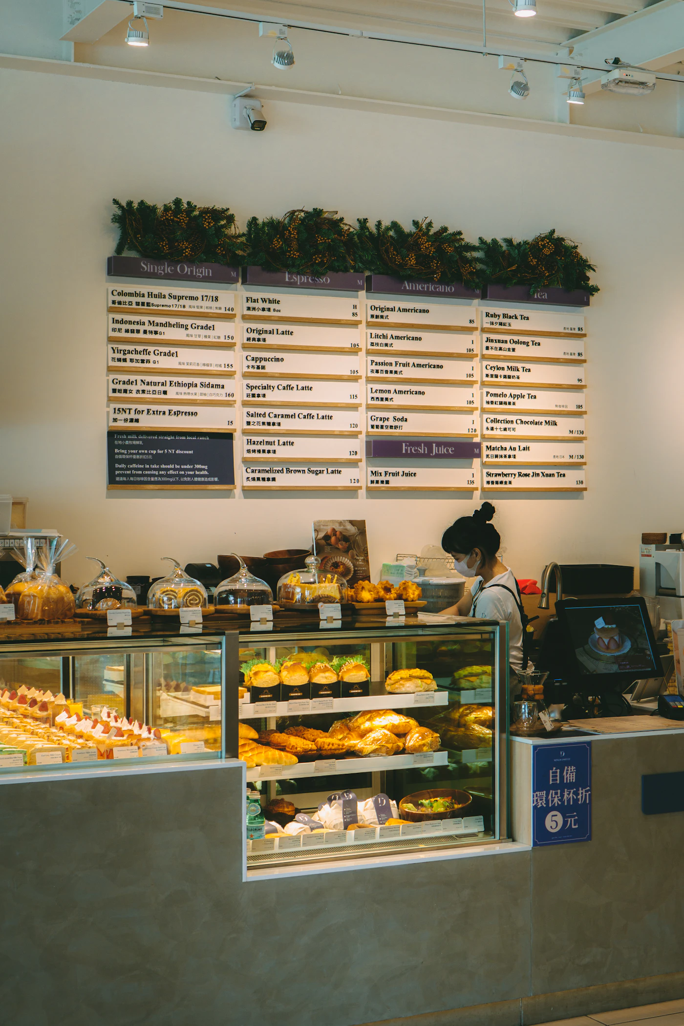Baker working behind pastry counter