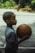 Young boy holds a basketball, ready to play.