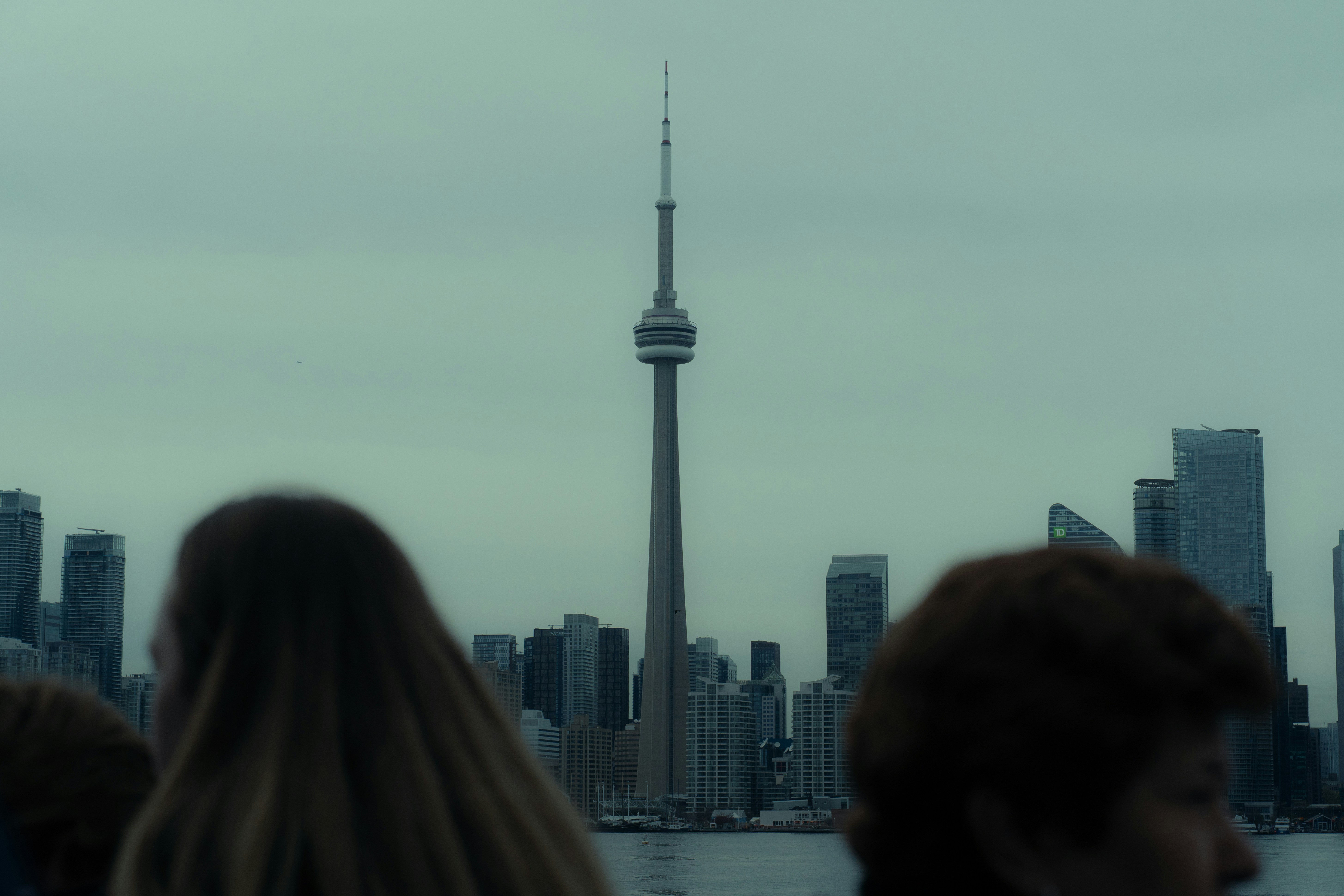The cn tower stands tall in the toronto skyline.