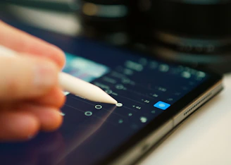 Editor retouching product photos on a digital tablet
