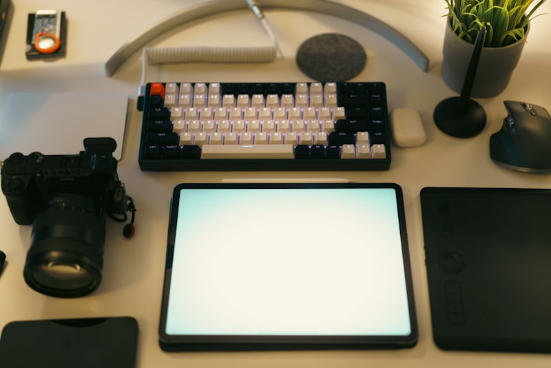 Mirrorless digital camera desk setup with keyboard and accessories for vlogging
