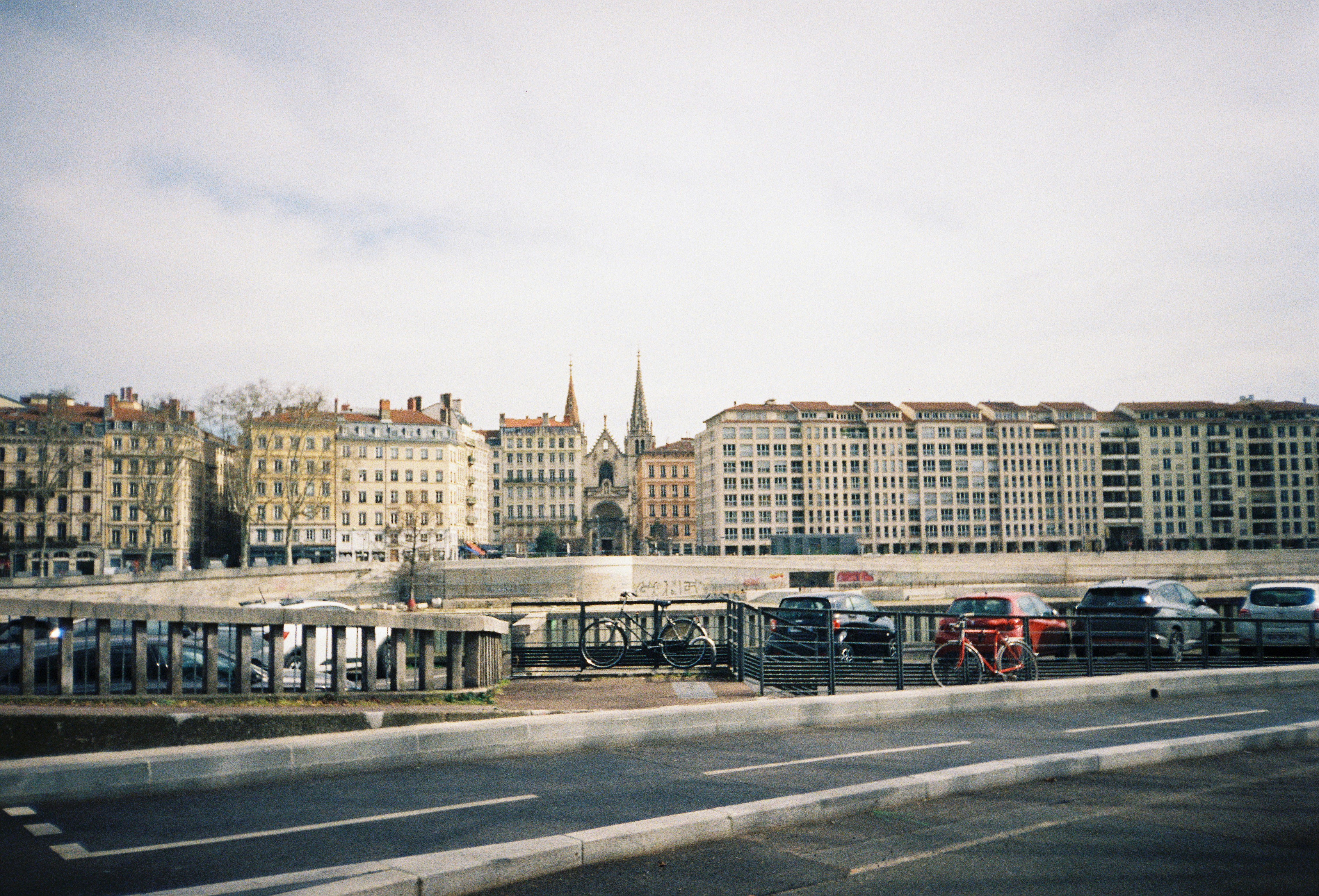 Cityscape with buildings and cloudy sky.