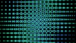 Blue and green abstract pattern against a dark background.