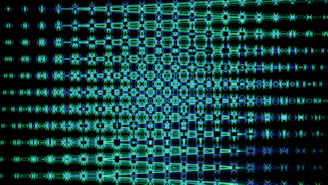 Blue and green abstract pattern against a dark background.