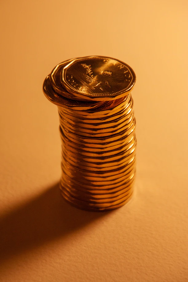 A tall stack of shiny gold coins.