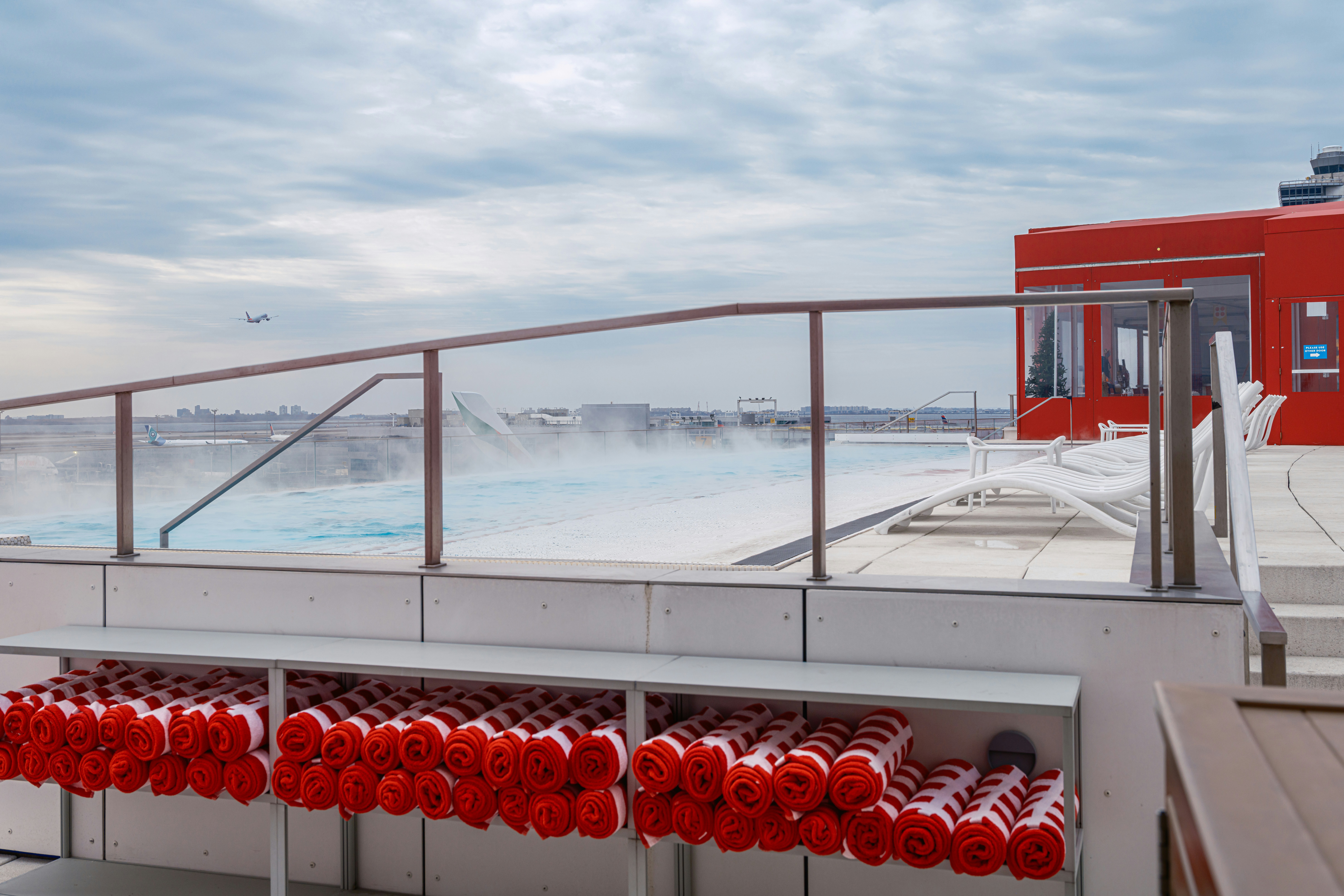 Luxury rooftop pool with city skyline view