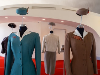 Vintage twa flight attendant uniforms are on display.