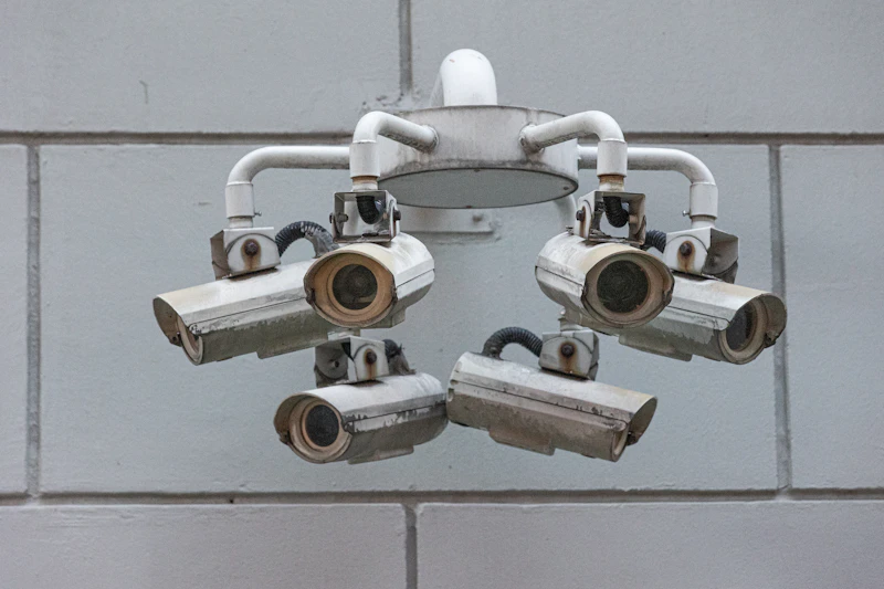 Ring of security cameras mounted on a concrete wall