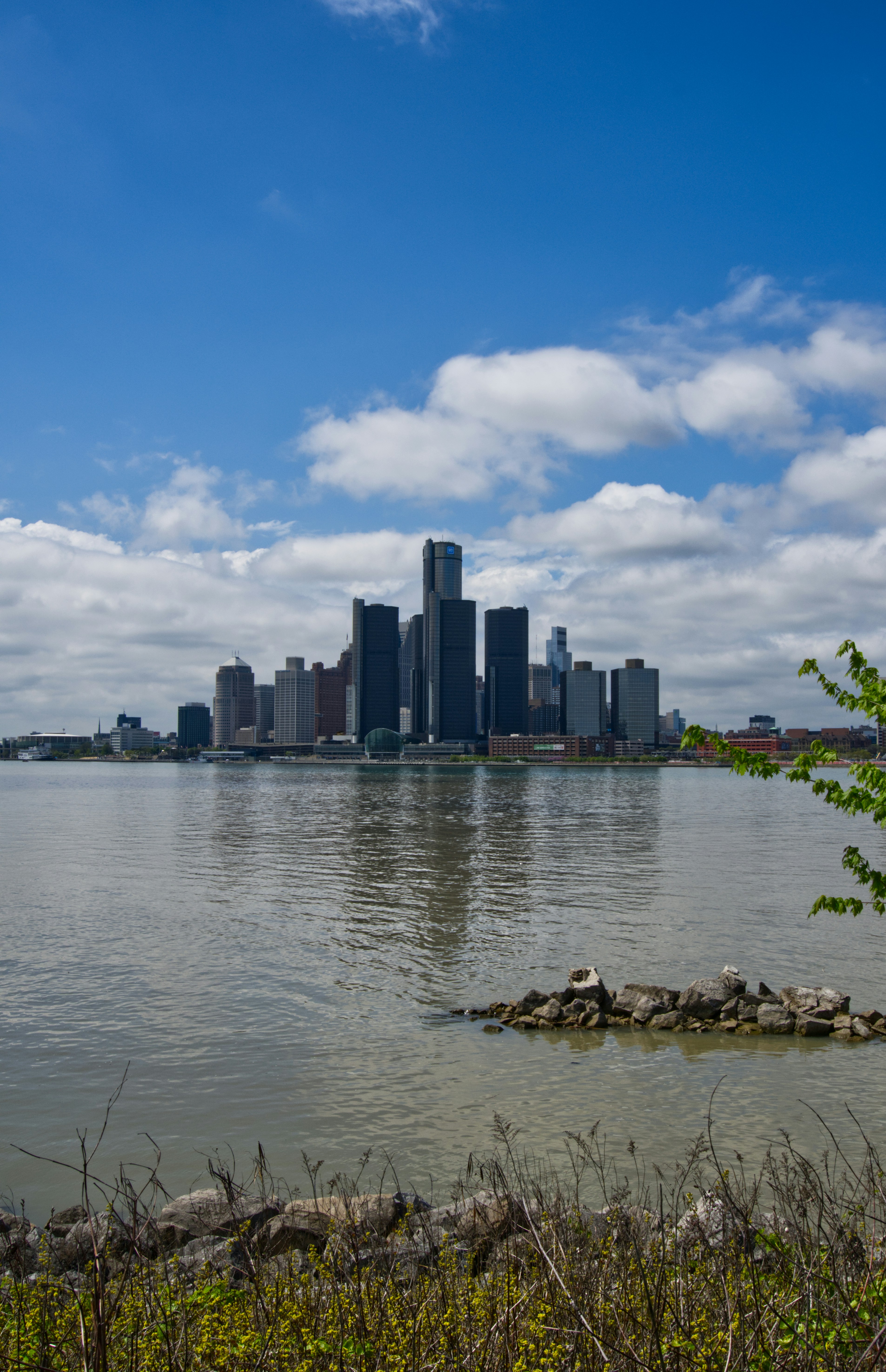 The detroit skyline reflected in the water.