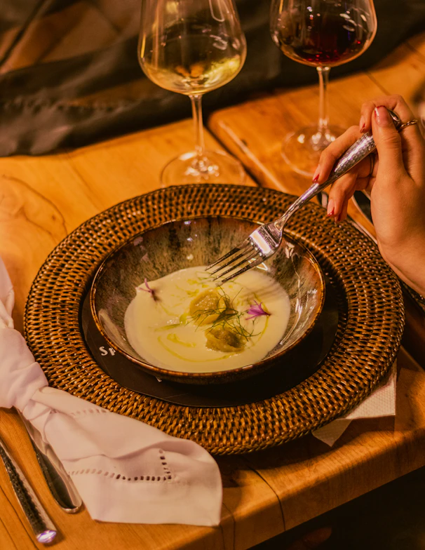 Fine dining: a person is eating soup.