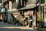Japanese shops line a quaint, sunlit street