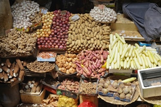 A colorful market stall displays a variety of fresh produce.