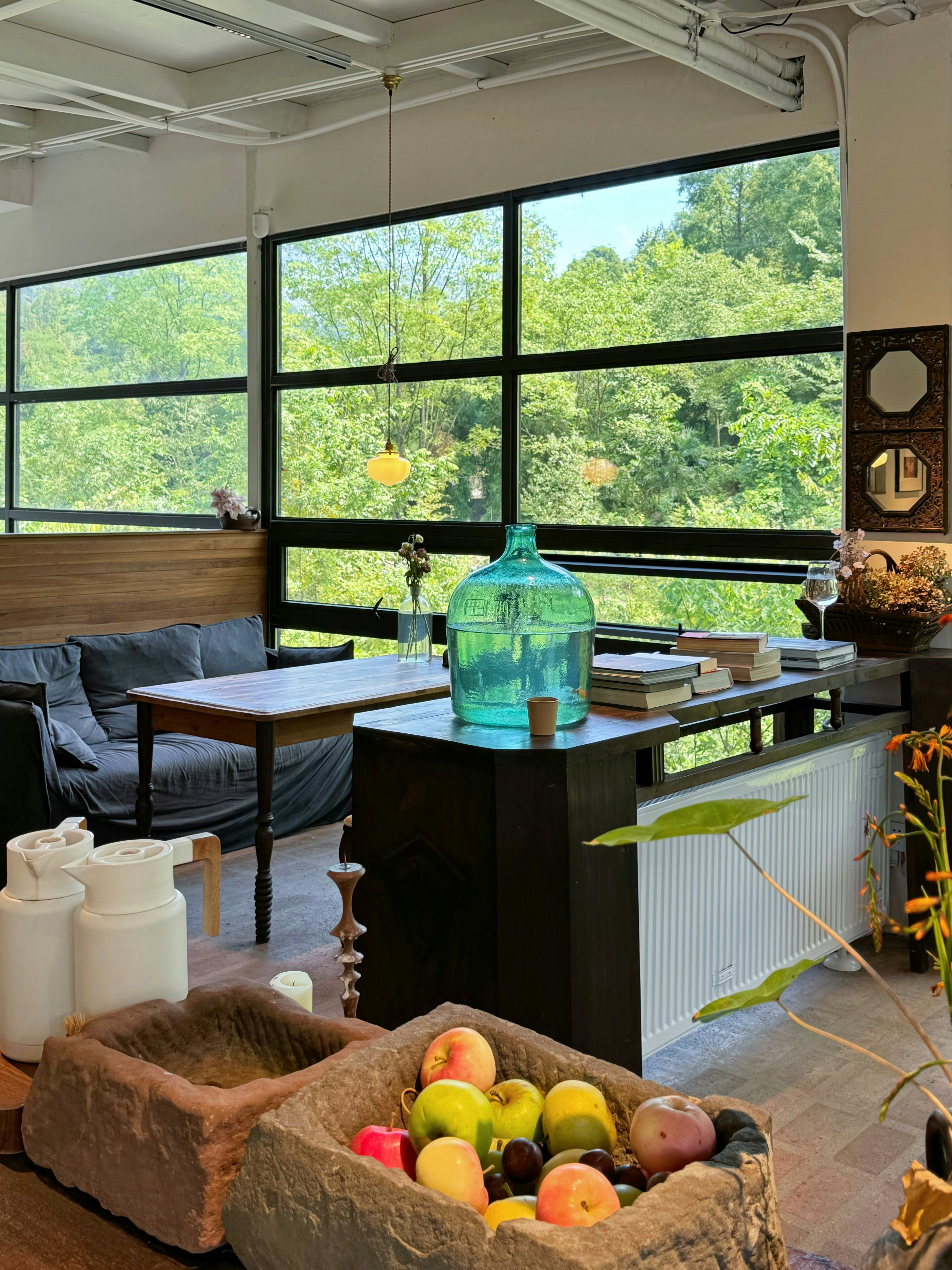 Cozy room with a scenic view of green trees.