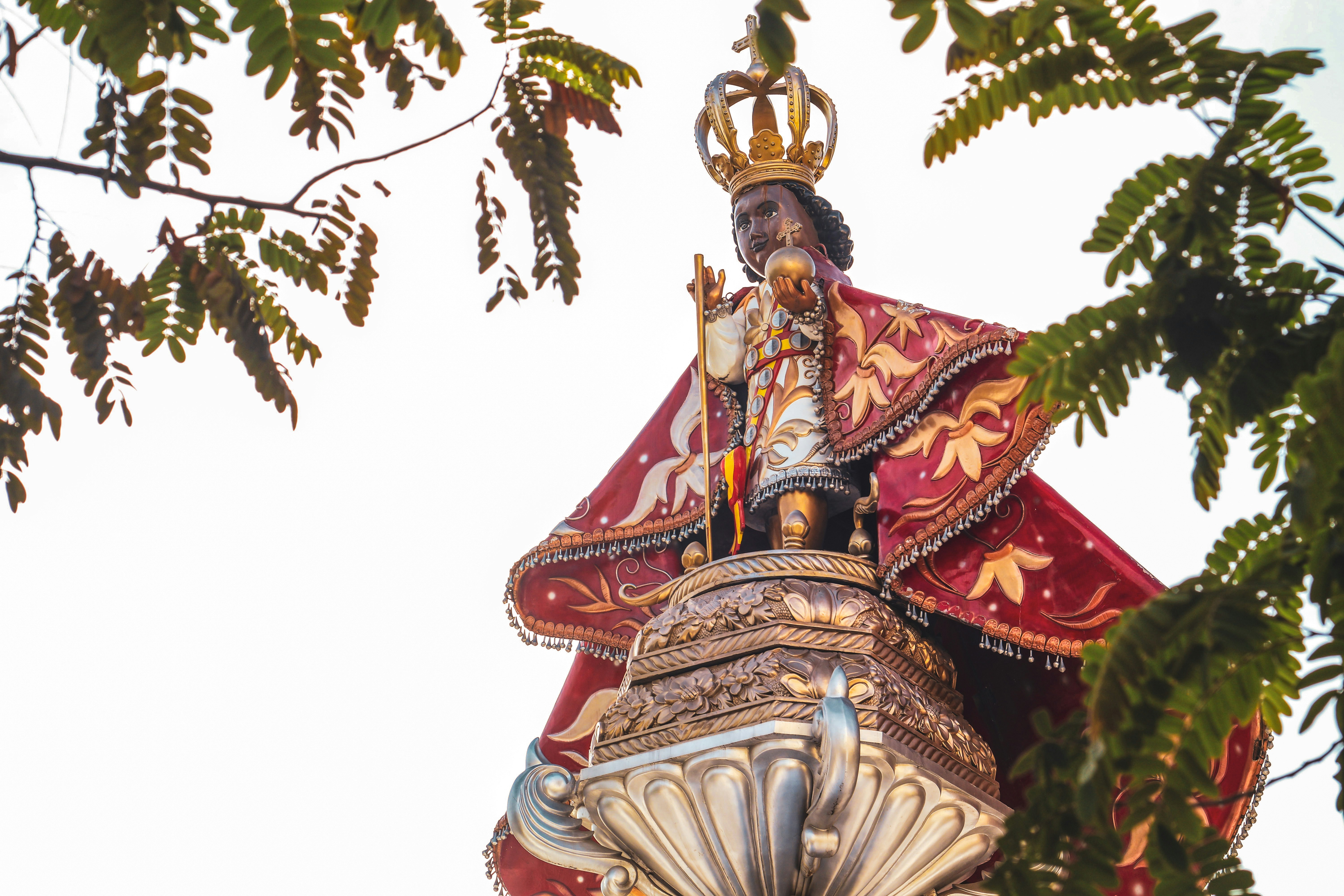 The statue of santo niño in the sunlight.