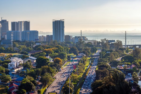 Cityscape with buildings, highway, and a sea view — George Town, Malaysia
