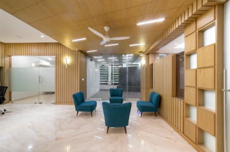 A modern office reception area with comfortable seating.