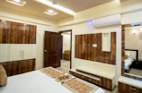 A modern bedroom with wooden accents is shown.
