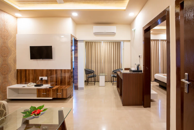 Elegantly appointed king guest room with warm lighting