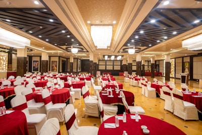 An elegant ballroom is ready for a festive event.