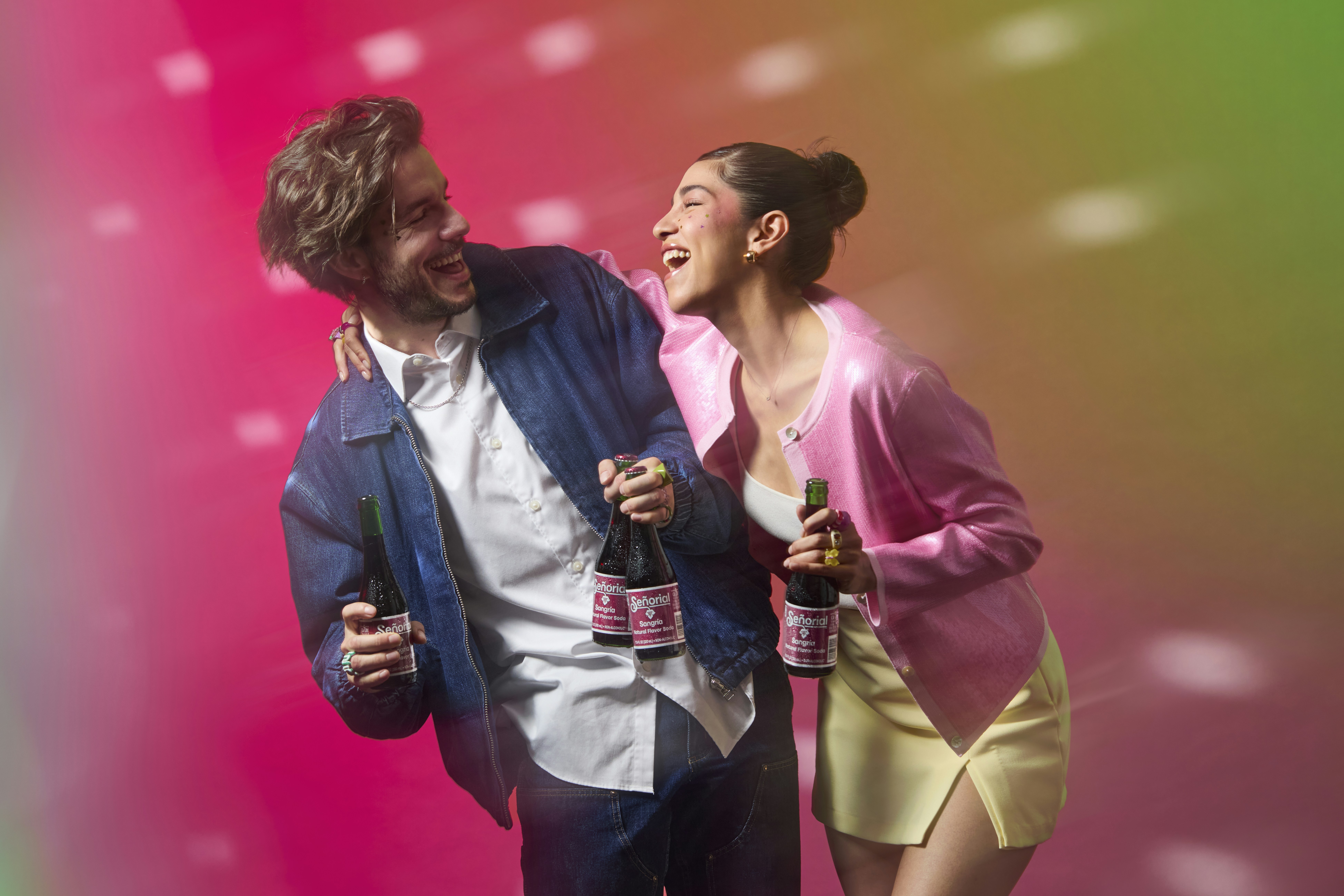 Happy people enjoy drinks at a party.