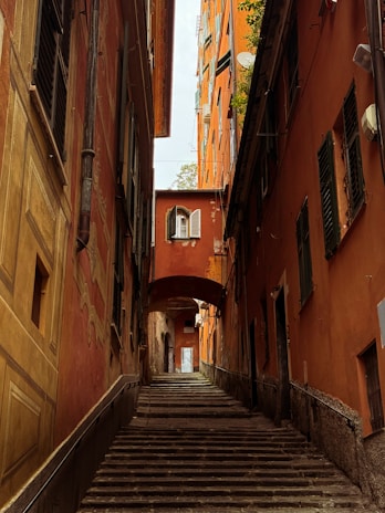 Narrow alley with colorful buildings and stairs.