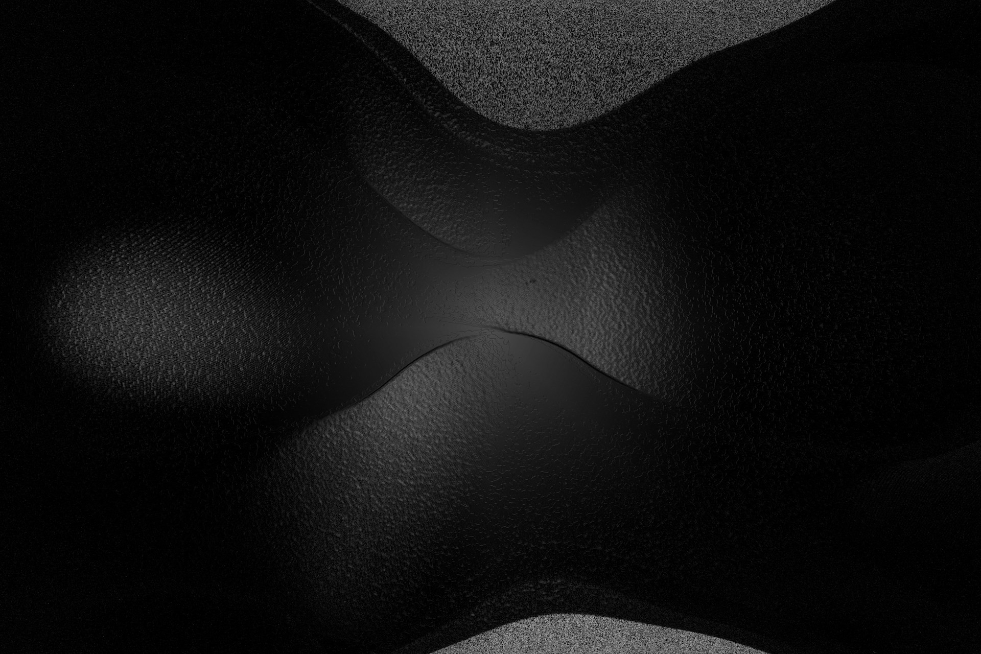 Abstract, curved black shapes with subtle shading.