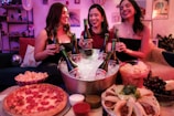 Three friends enjoy beer, snacks, and good company.